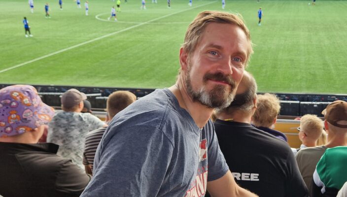 Visionites IT-specialist and engineering specialist Juha Sälli visiting a soccer game.